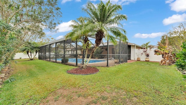 view of yard featuring a fenced in pool and a lanai