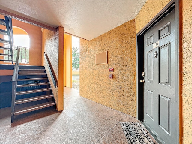 interior space featuring a textured ceiling