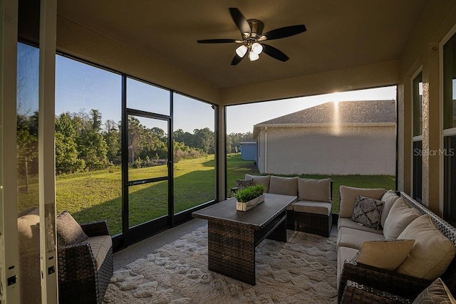 sunroom featuring ceiling fan and a healthy amount of sunlight