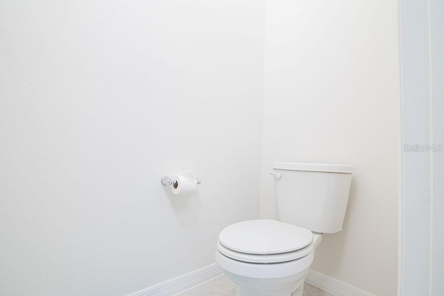 bathroom featuring tile patterned floors and toilet