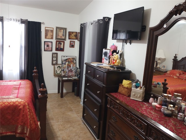 bedroom featuring multiple windows