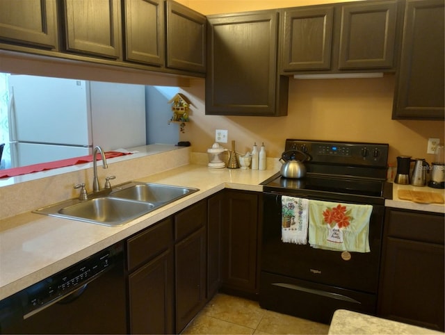 kitchen featuring sink, light tile patterned floors, black appliances, and dark brown cabinets