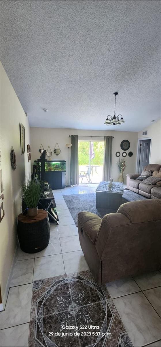 tiled living room with a textured ceiling