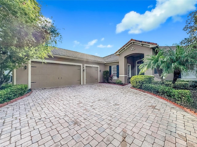 view of front of property with a garage