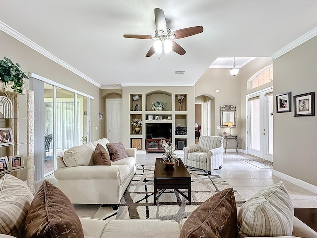 living room featuring french doors, ceiling fan, built in features, ornamental molding, and light tile patterned flooring