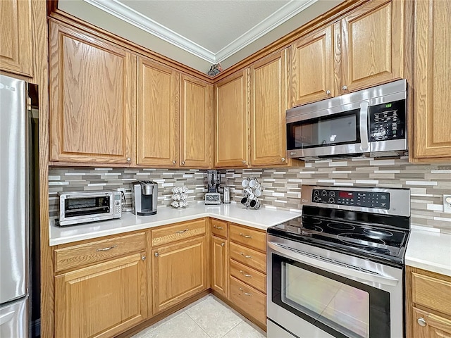 kitchen featuring decorative backsplash, light tile patterned flooring, ornamental molding, and stainless steel appliances