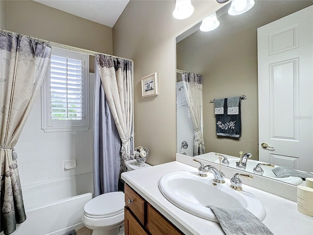 full bathroom with vanity, shower / tub combo, and toilet