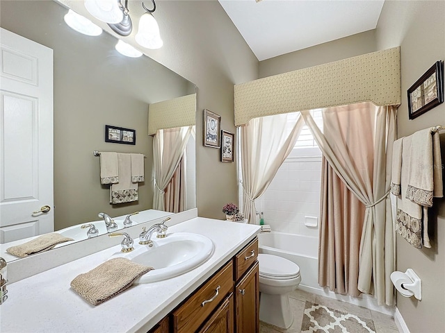 full bathroom featuring tile patterned floors, vanity, toilet, and shower / bath combo with shower curtain