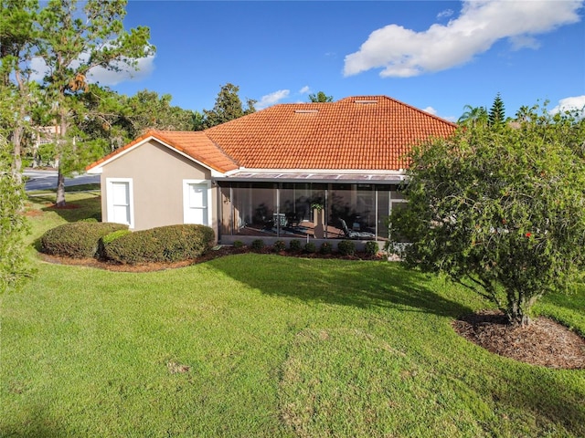 back of house featuring a yard