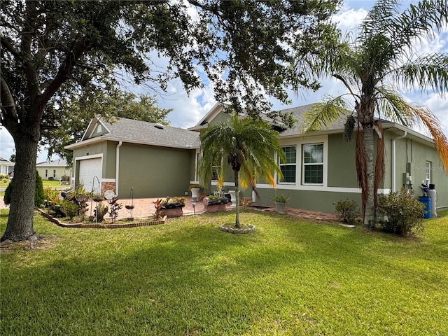 view of front of property featuring a garage and a front lawn