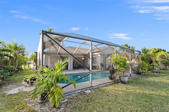 view of swimming pool with glass enclosure and a yard