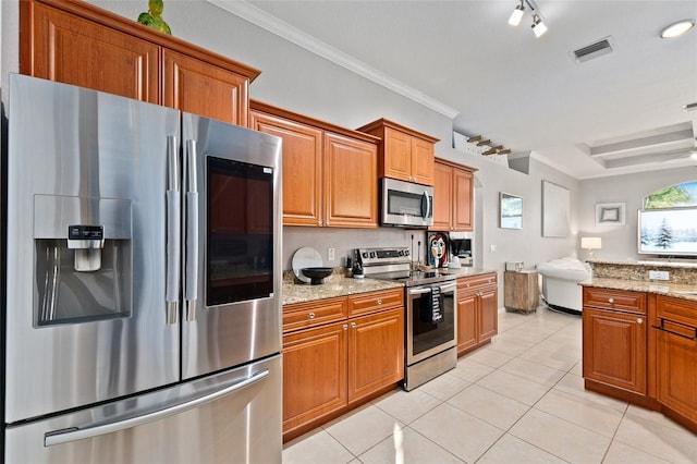 kitchen featuring light stone counters, light tile patterned floors, crown molding, and appliances with stainless steel finishes