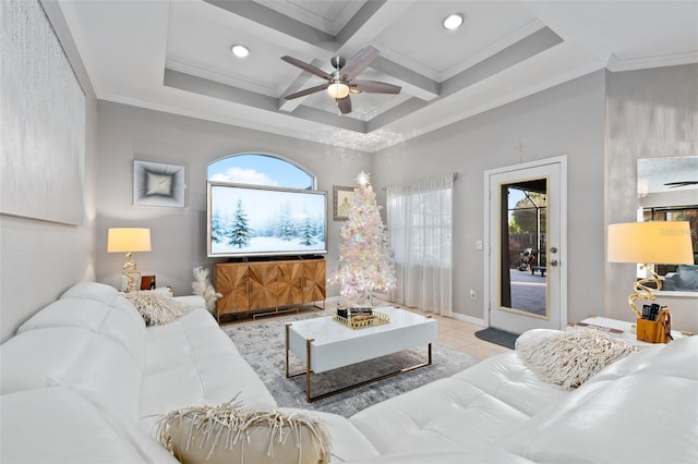 living room featuring a wealth of natural light, ceiling fan, coffered ceiling, beamed ceiling, and crown molding