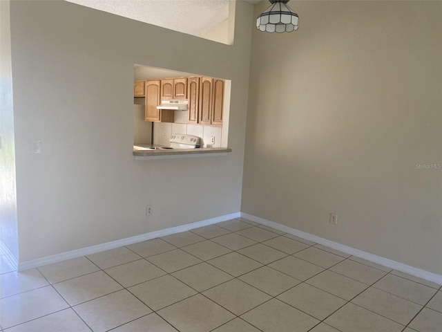 34 Pine Island Cir, Kissimmee, FL 34743 - unfurnished dining area featuring light tile patterned floors and lofted ceiling