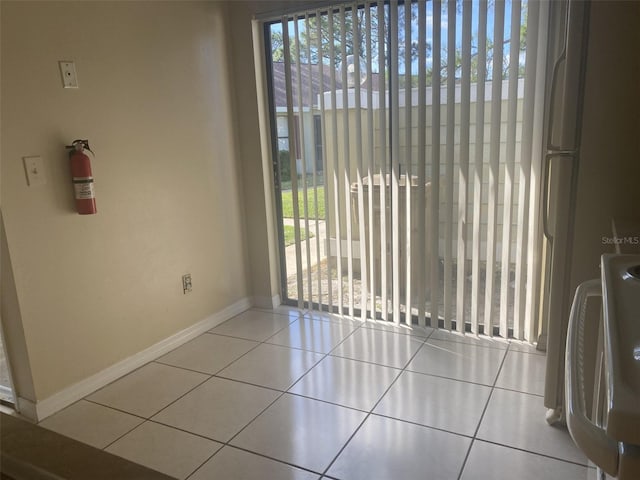 34 Pine Island Cir, Kissimmee, FL 34743 - unfurnished dining area with baseboards and tile patterned flooring