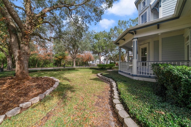 view of yard with covered porch