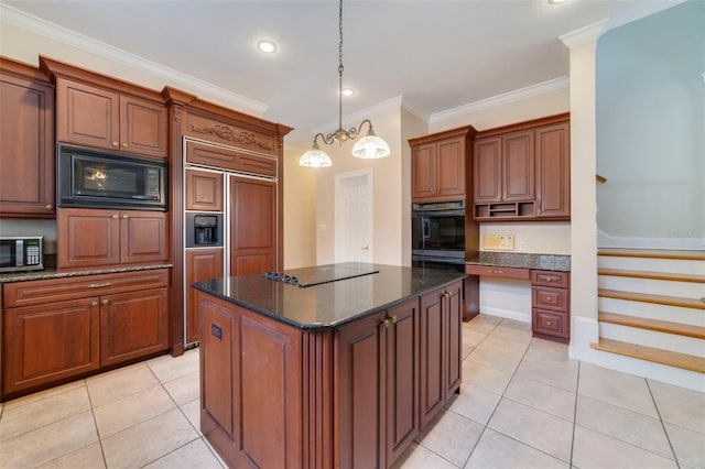 kitchen with dark stone counters, a kitchen island, ornamental molding, and black appliances