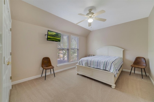 bedroom featuring ceiling fan, light carpet, and lofted ceiling