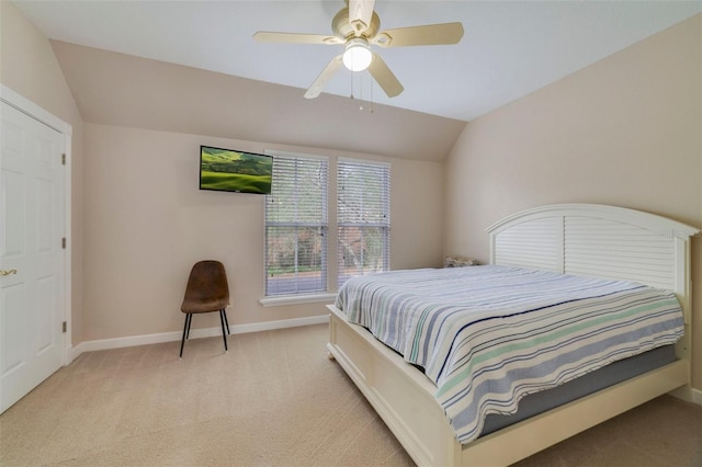 carpeted bedroom featuring ceiling fan and lofted ceiling