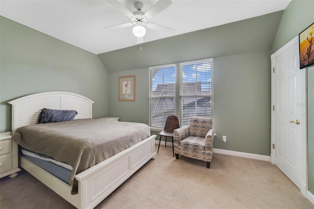 bedroom with ceiling fan, light carpet, and lofted ceiling