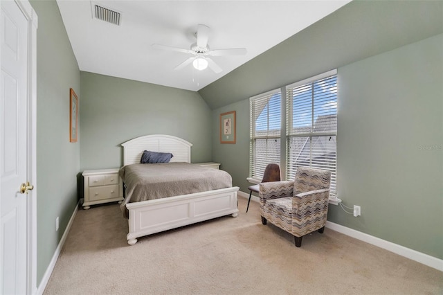 carpeted bedroom with ceiling fan and lofted ceiling