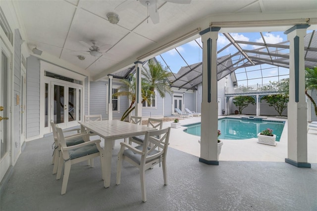 view of pool featuring an in ground hot tub, french doors, a patio, and a lanai