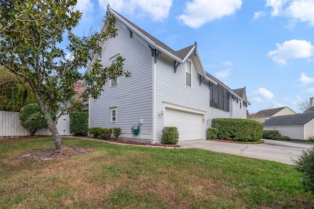 view of side of property with a yard and a garage