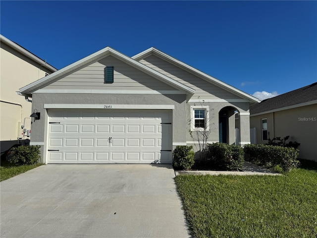 ranch-style home featuring a garage