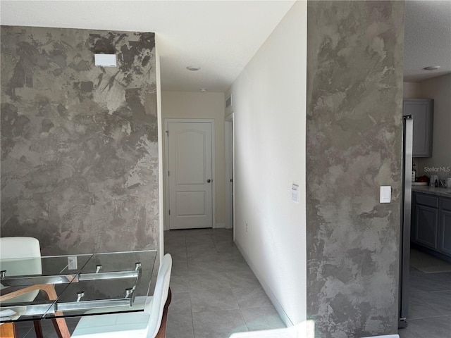 bathroom with tile patterned floors and vanity