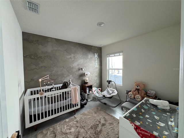 bedroom featuring a crib