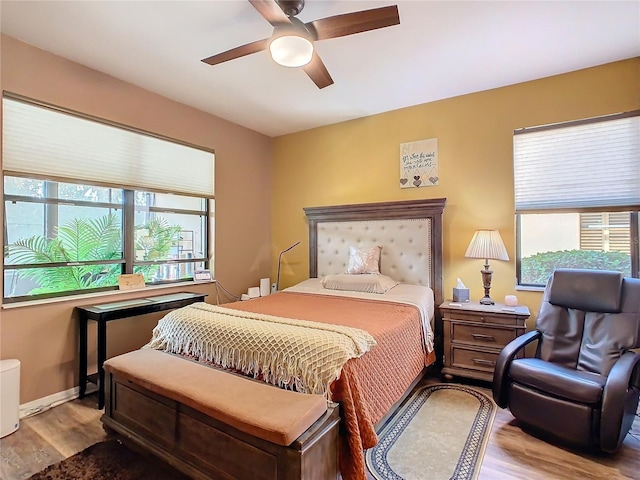 bedroom featuring light wood-type flooring and ceiling fan