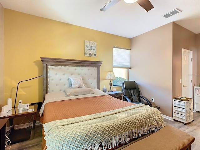 bedroom featuring ceiling fan and hardwood / wood-style floors