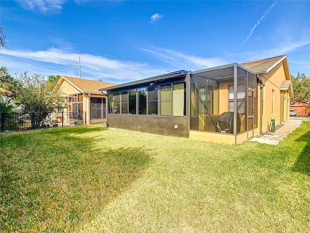 back of house featuring a yard