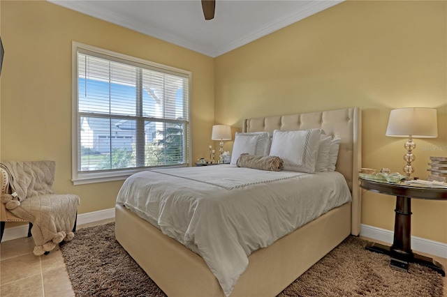 tiled bedroom featuring ceiling fan, ornamental molding, and multiple windows