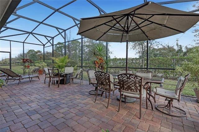 view of patio / terrace featuring glass enclosure