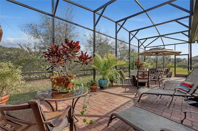 view of patio / terrace with a lanai