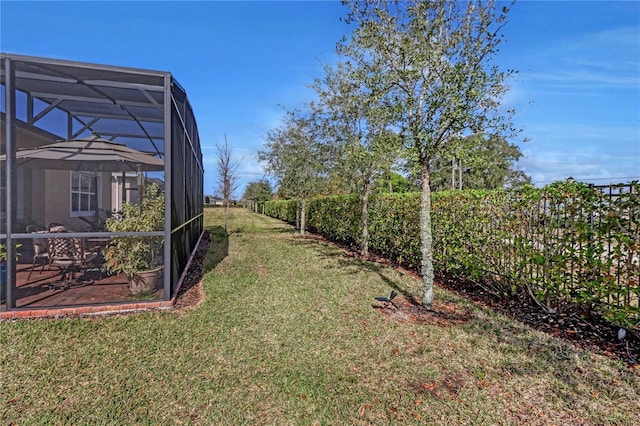 view of yard with a patio area and a lanai