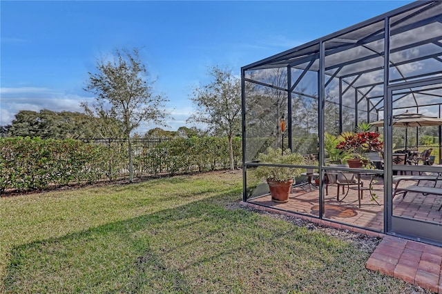 view of yard with a patio area and a lanai