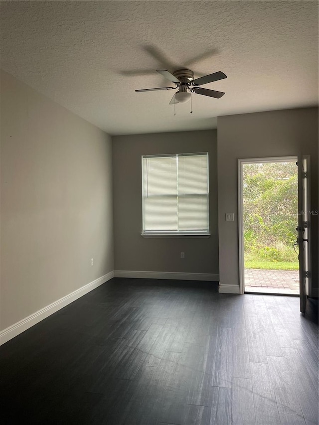 unfurnished room featuring ceiling fan and a textured ceiling