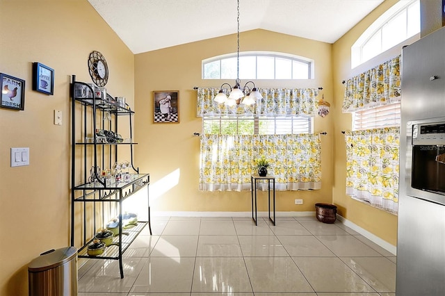 interior space with a chandelier and lofted ceiling