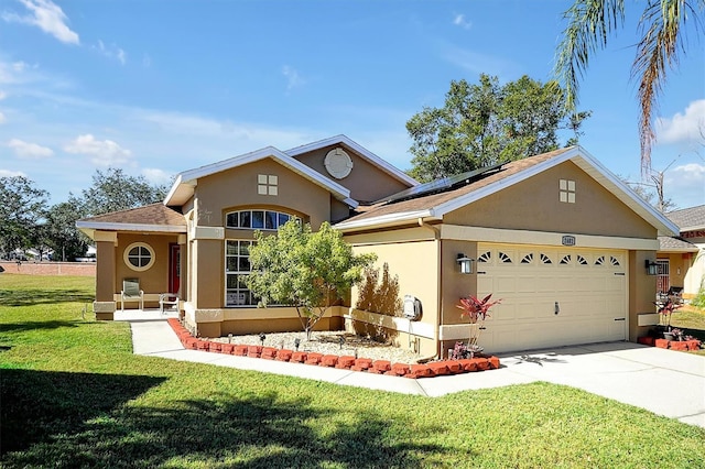 view of front of property with a garage, a front yard, and solar panels