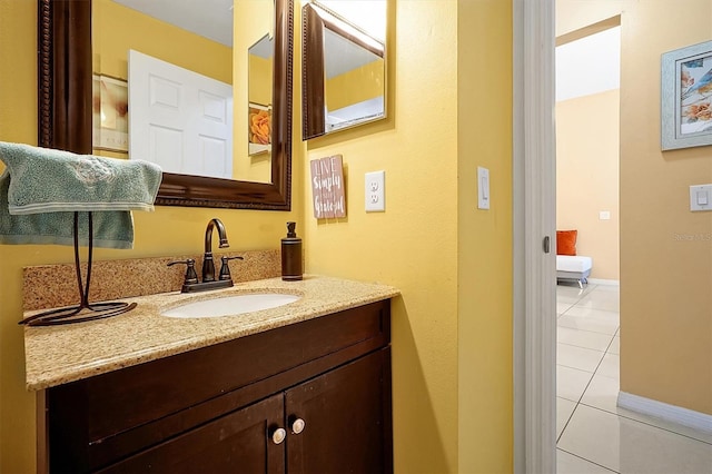 bathroom with tile patterned floors and vanity