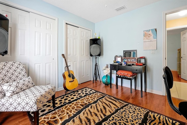 sitting room featuring hardwood / wood-style flooring