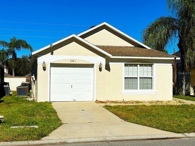 single story home with cooling unit, a garage, and a front lawn