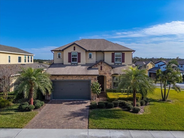 view of front of house with a front lawn and a garage