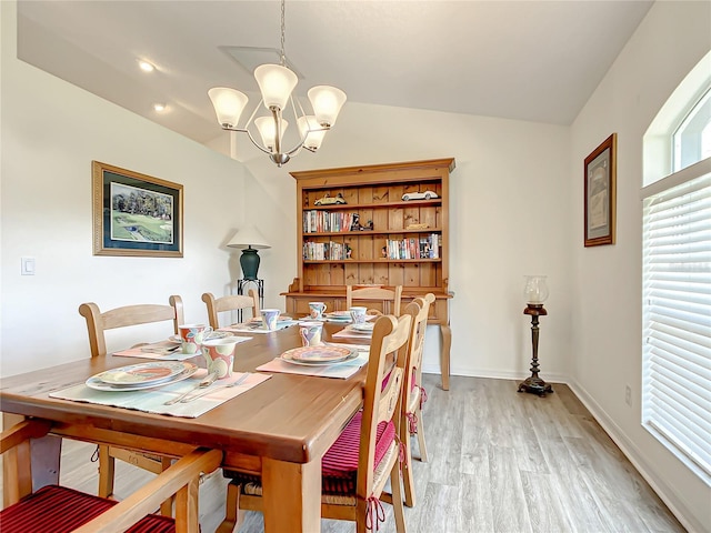 1281 N Timucuan Trl, Inverness, FL 34453 - dining area with light hardwood / wood-style floors, vaulted ceiling, and a notable chandelier
