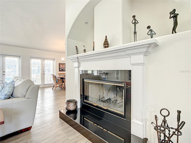 1281 N Timucuan Trl, Inverness, FL 34453 - living room with hardwood / wood-style flooring, vaulted ceiling, and french doors