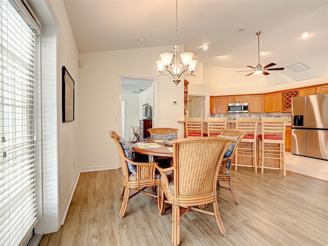 1281 N Timucuan Trl, Inverness, FL 34453 - dining area with lofted ceiling, ceiling fan with notable chandelier, and light wood-type flooring