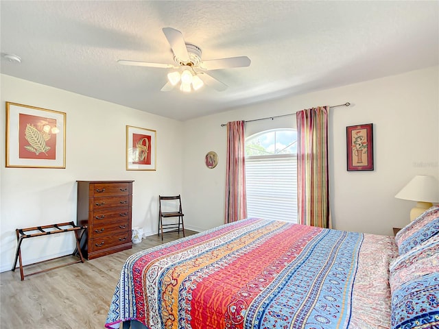 1281 N Timucuan Trl, Inverness, FL 34453 - bedroom featuring ceiling fan, a textured ceiling, and light hardwood / wood-style flooring
