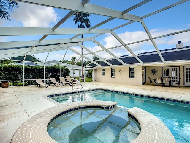 1281 N Timucuan Trl, Inverness, FL 34453 - view of swimming pool with an in ground hot tub, a patio, and glass enclosure